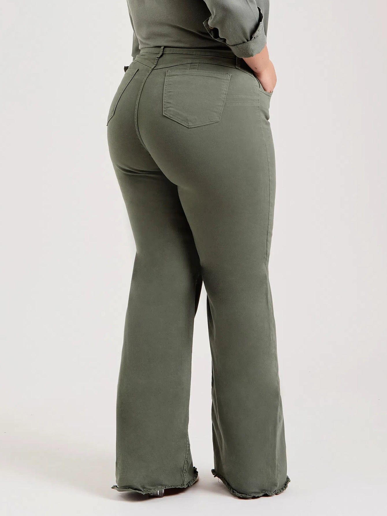 Pantalones acampanados deshilachados de color sólido de moda elásticos ajustados